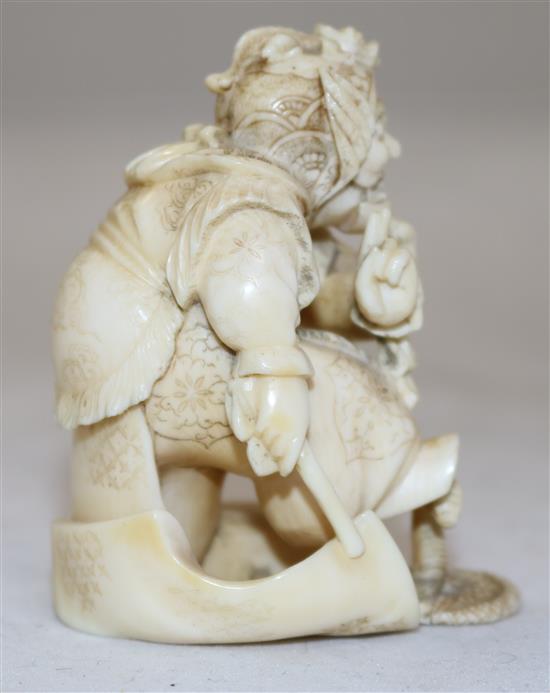 A Japanese ivory okimono of a bugaku dancer